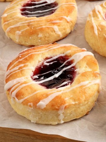 gluten-free Danish topped with jam on on white parchment paper