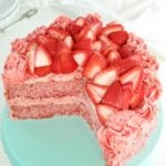 gluten-free strawberry cake on a blue cake plate