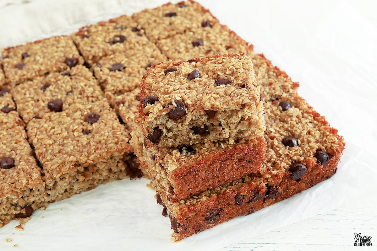 oatmeal bars stacked on white parchment paper