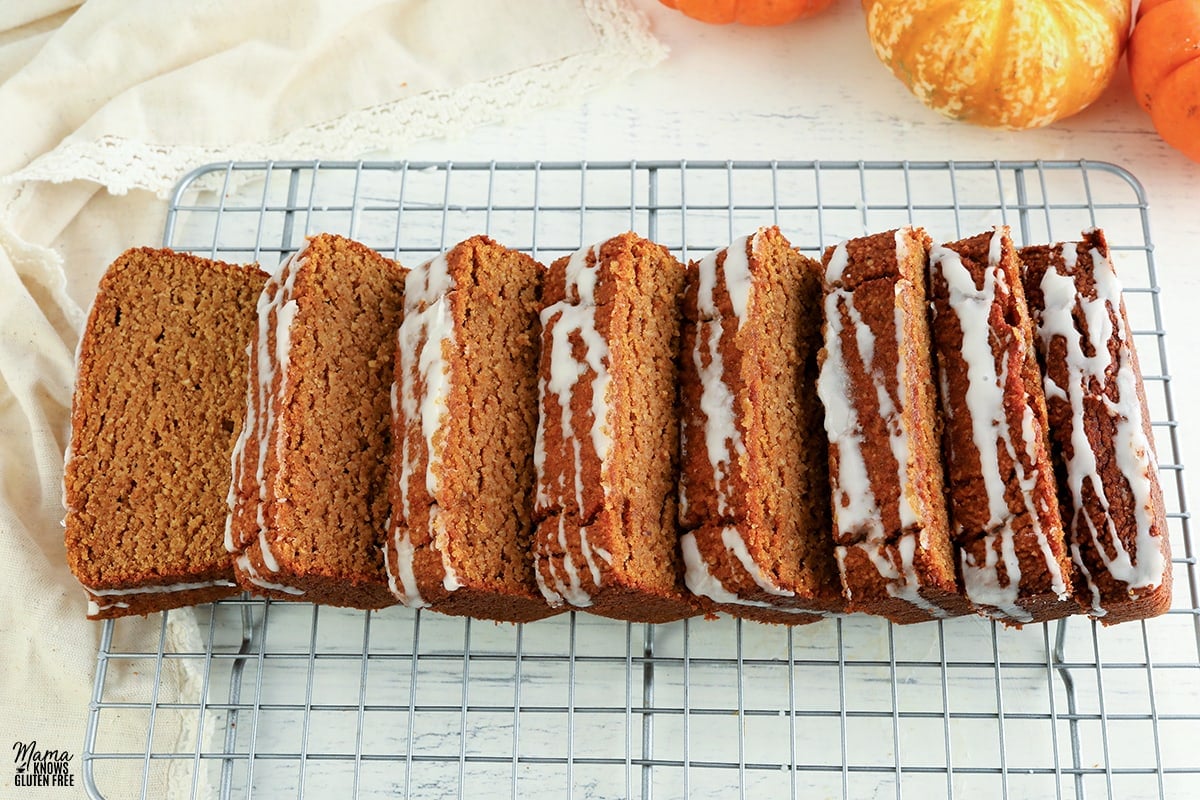 almond flour pumpkin bread sliced on a cooling rack