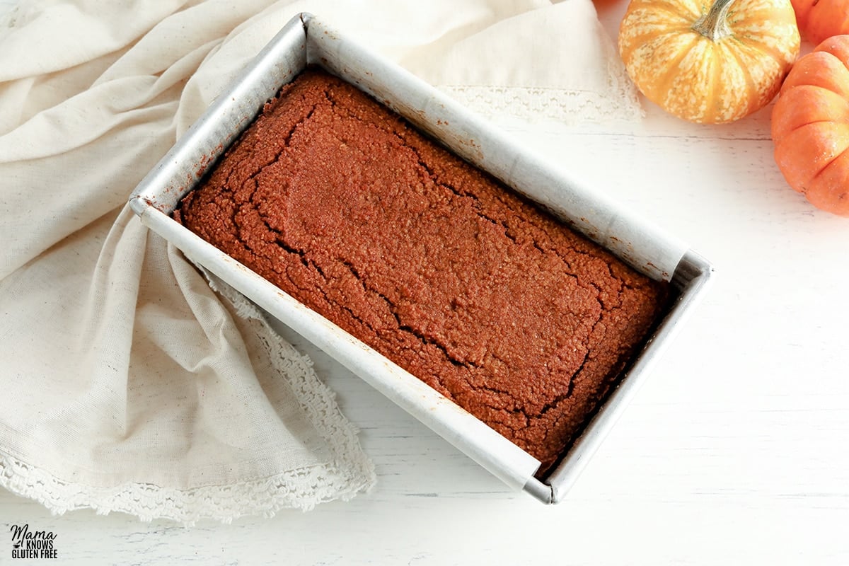 almond flour pumpkin bread in a sliver baking pan