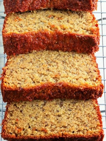 almond flour banana bread sliced on a wire cooling rack