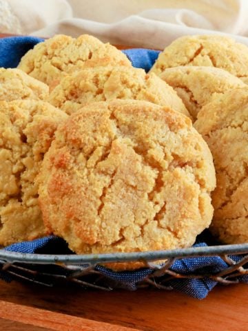 almond flour biscuits in a blue napkin lined basket