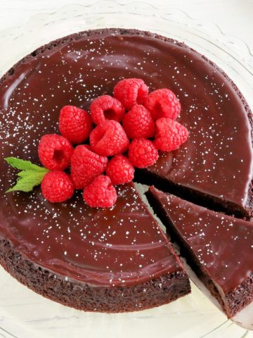 flourless chocolate cake topped with raspberries