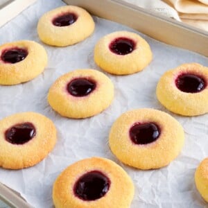 gluten-free thumbprint cookies on a baking sheet