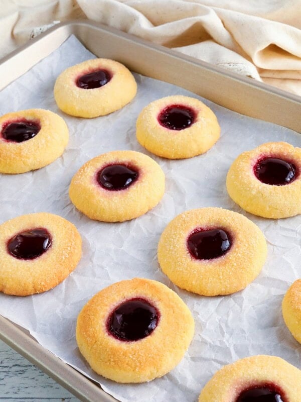 gluten-free thumbprint cookies on a baking sheet