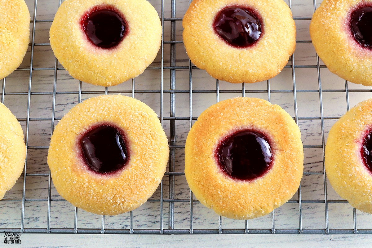 gluten-free thumbprint cookies on a wire cooling rack