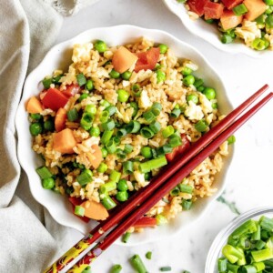 Gluten-Free Fried Rice in a bowl with chop sticks across