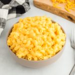 gluten-free mac and cheese in a bowl with a fork and napkin