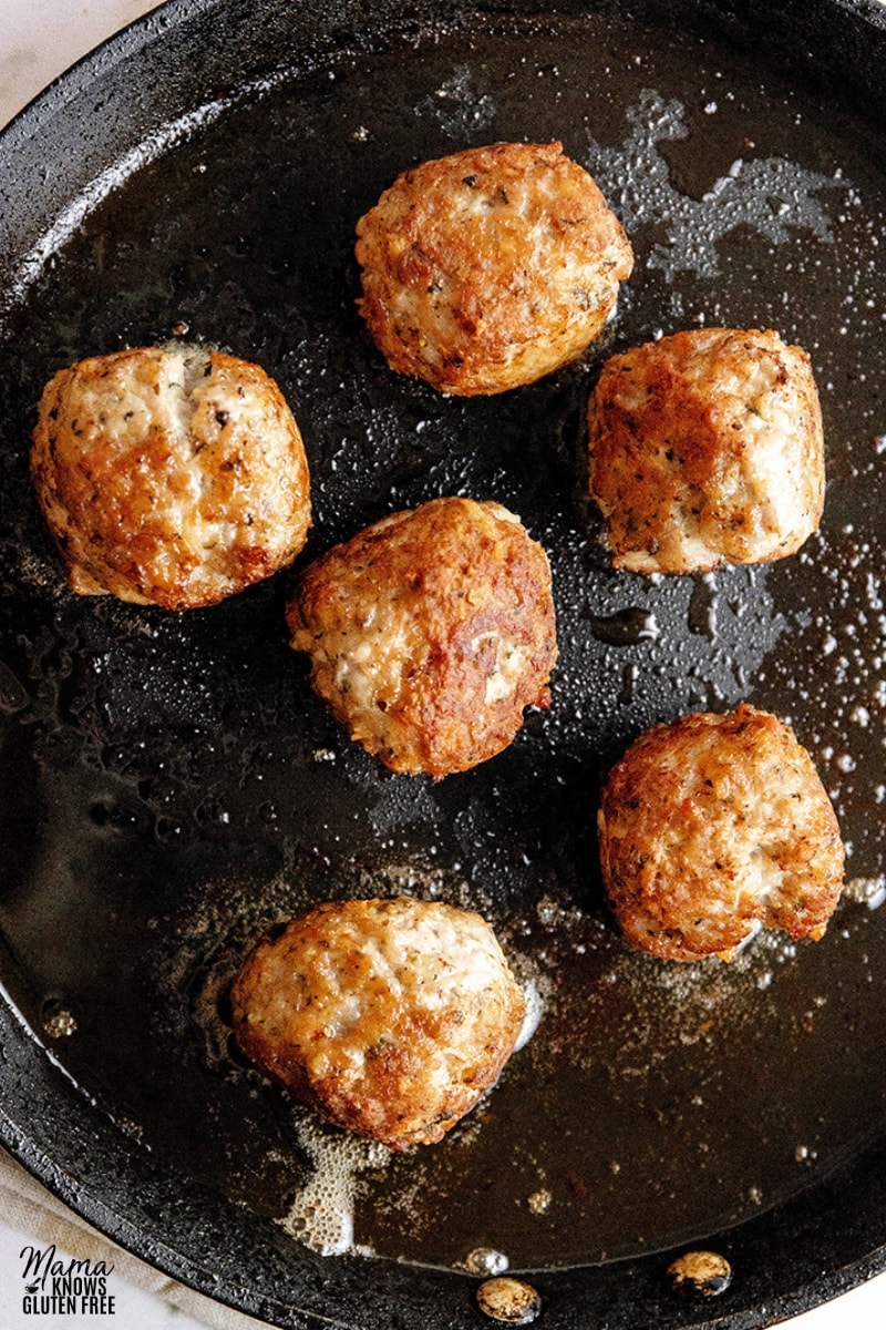 gluten-free turkey meatballs in a black frying pan