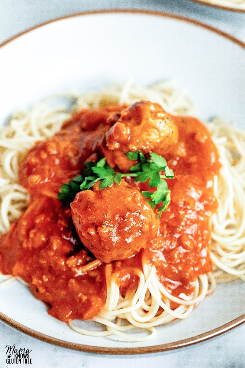 gluten-free turkey meatballs over pasta and tomato sauce