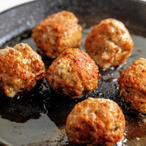 gluten-free turkey meatballs in a frying pan