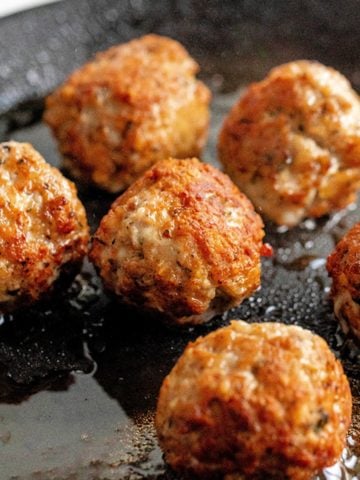 gluten-free turkey meatballs in a frying pan