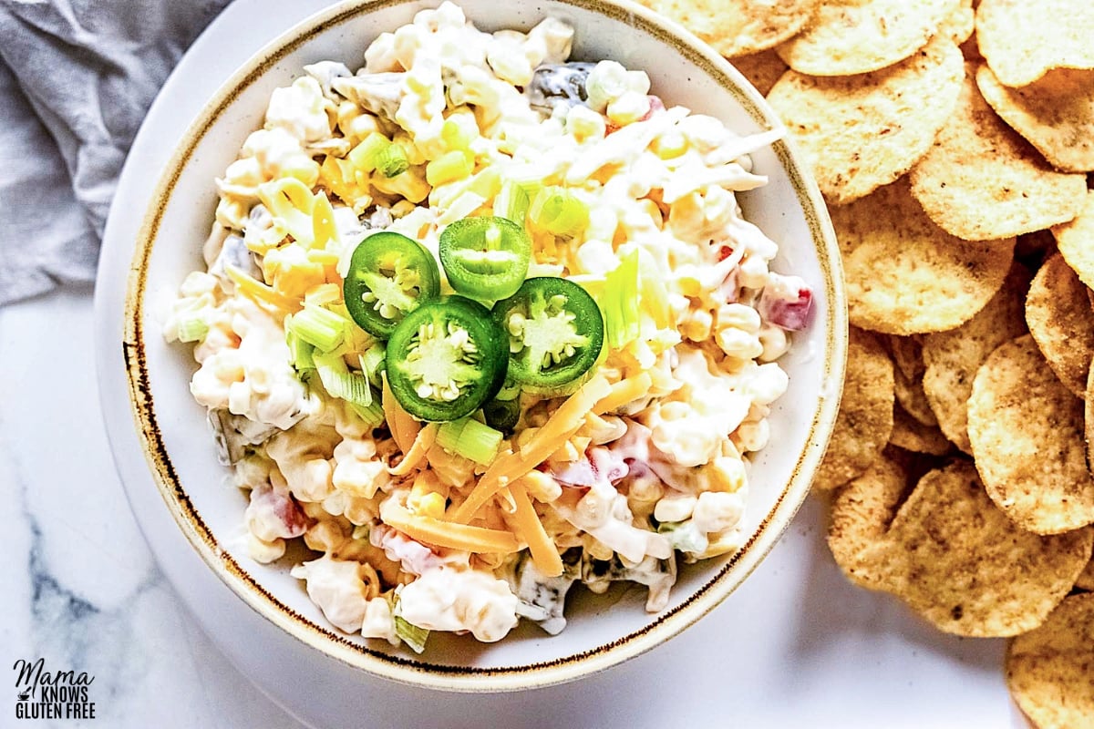 crack corn dip in a white bowl with corn chips