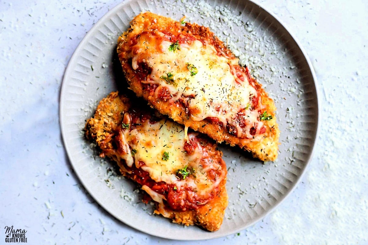 gluten-free chicken Parmesan on a white plate.