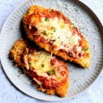 gluten-free chicken parmesan on a white plate