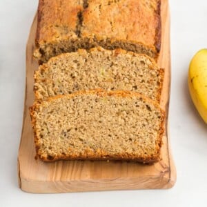 Oat flour banana bread with 2 cut slices.