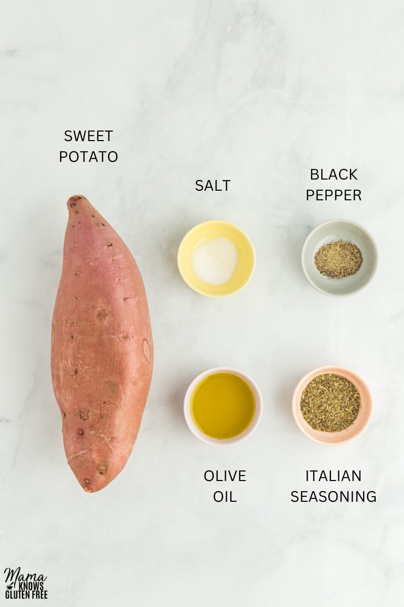 Ingredients used to make Roasted Sweet Potatoes in bowls on marble surface.