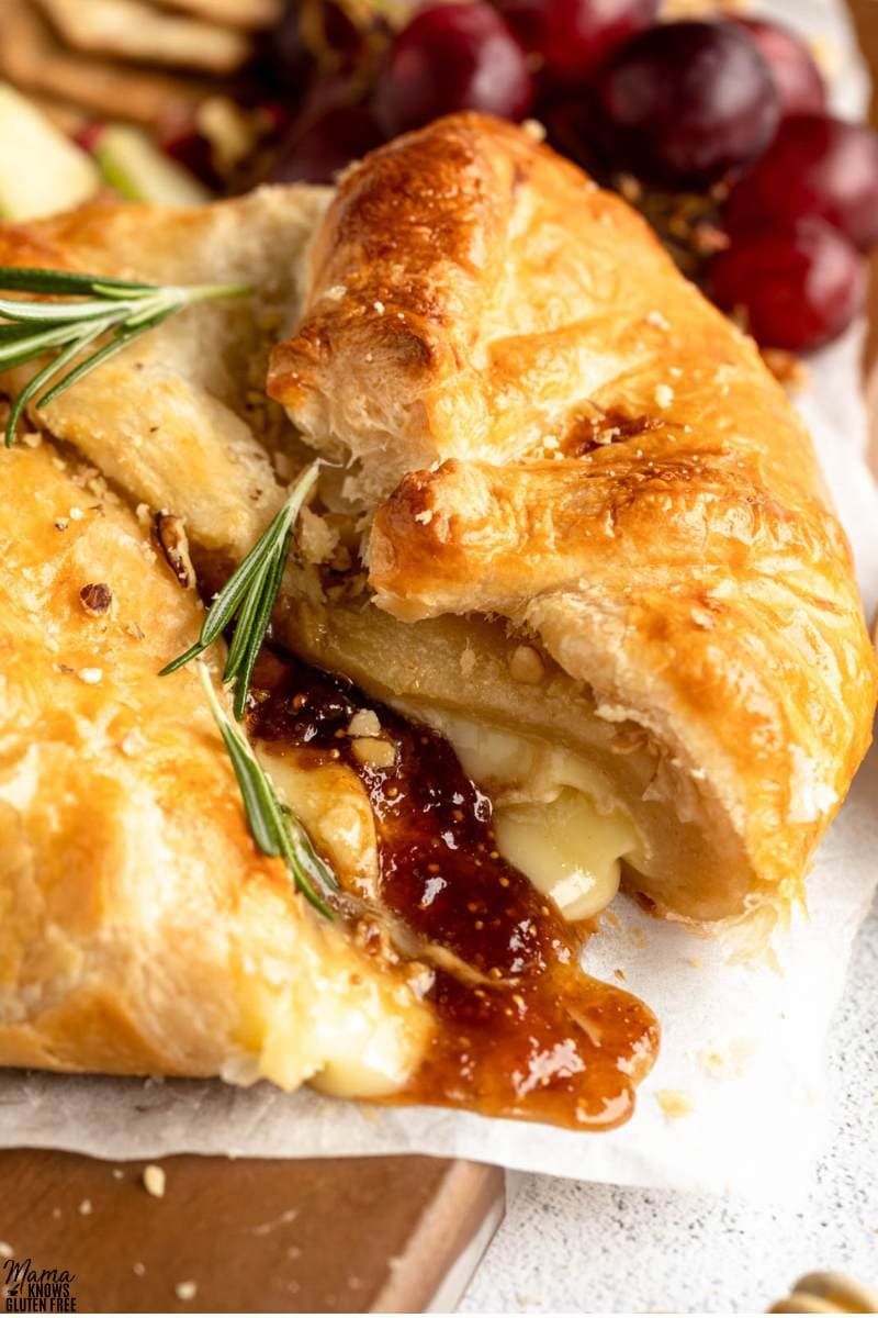 Gluten-Free Baked Brie cut open to reveal cheese and jam filling.