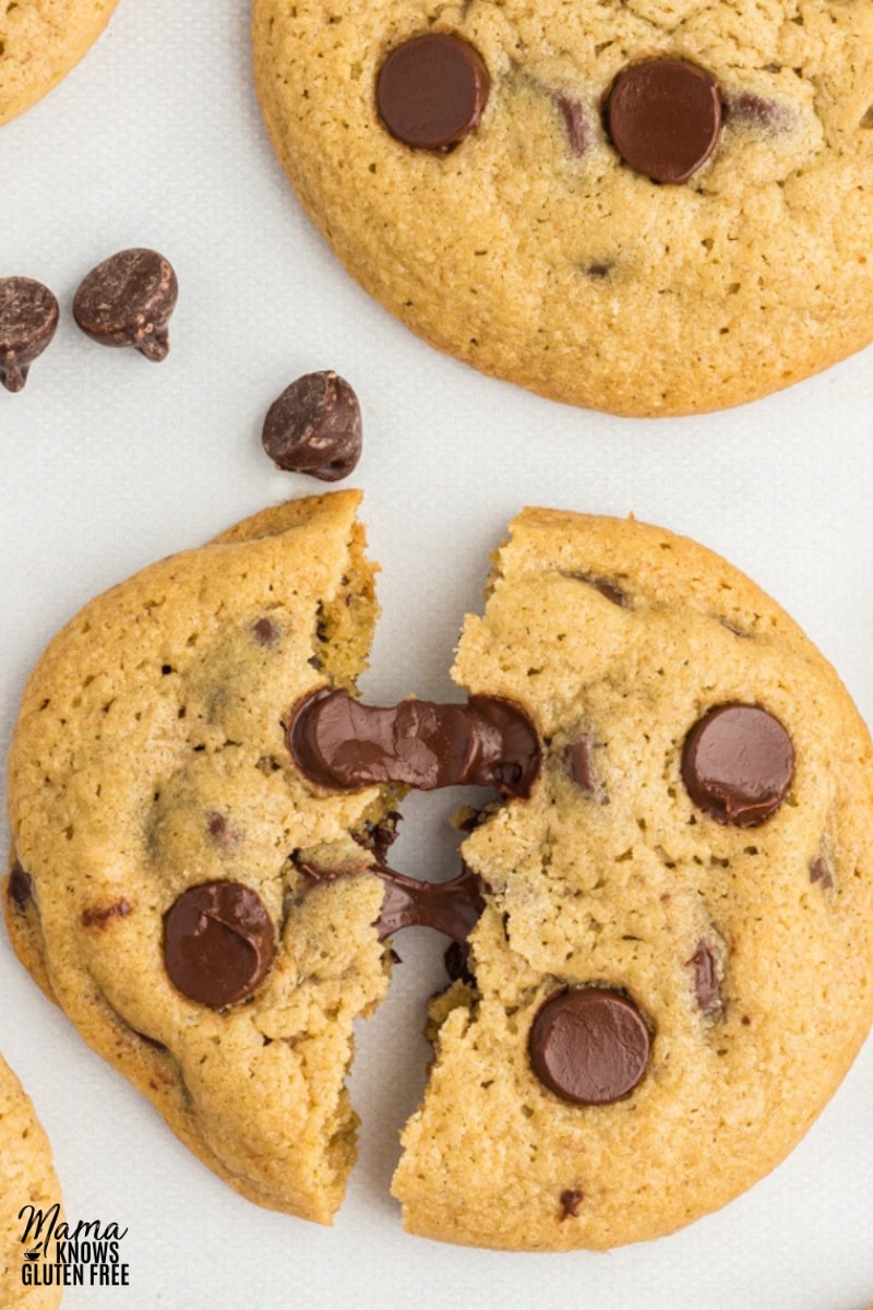 oat flour chocolate chip cookies broken in half to show chocolate gooeyness