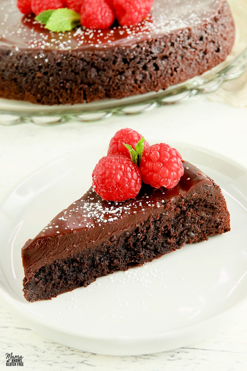 flourless chocolate cake slice on a white plate