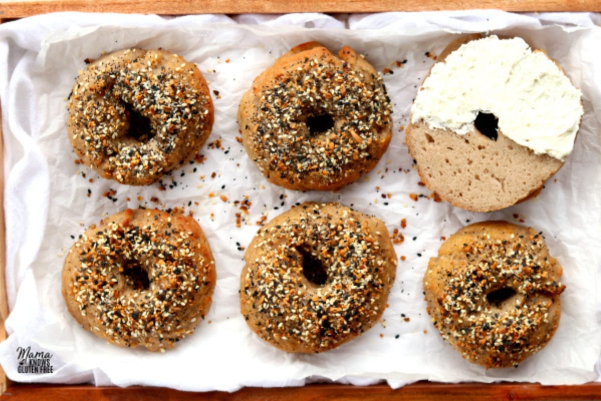 gluten-free bagels on a parchment paper on a wooden tray