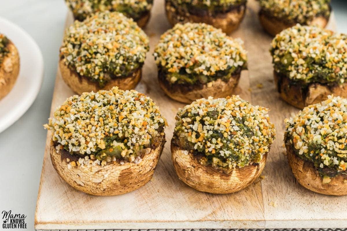 gluten-free stuffed mushrooms on a brown cutting board