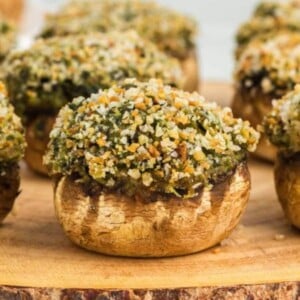 gluten-free stuffed mushrooms on an wood cutting board