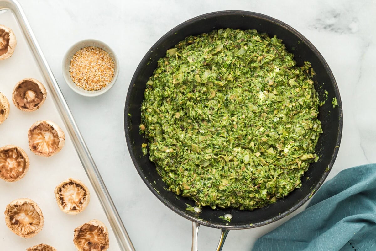 Filling for gluten-free stuffed mushrooms in a skillet.