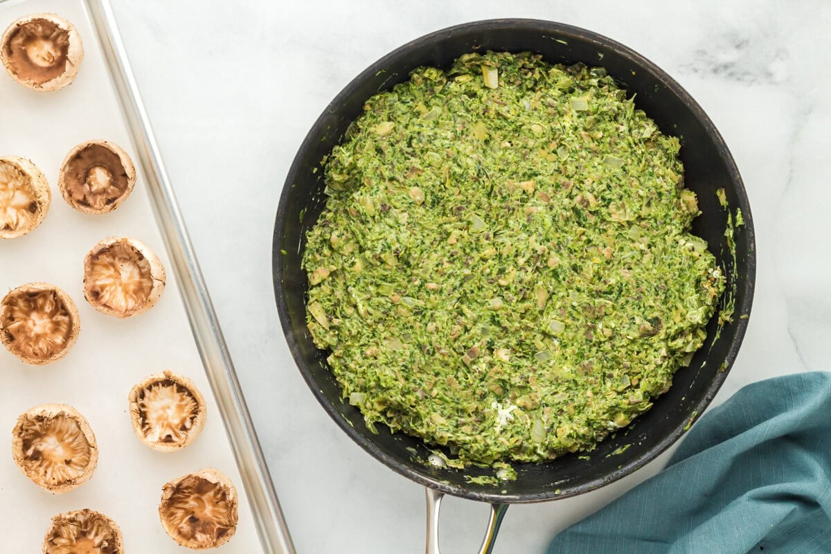 Filling for gluten-free stuffed mushrooms in a skillet.