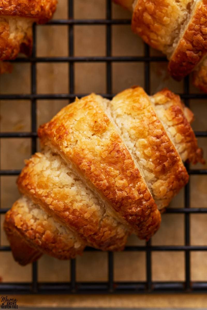 gluten-free croissants on a black wire cooling rack