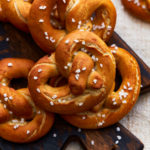 gluten free soft pretzels on a cutting board.