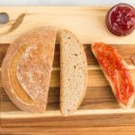 gluten-free sourdough bread on a wooden cutting board