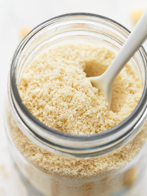 almond flour in a mason jar with a spoon.