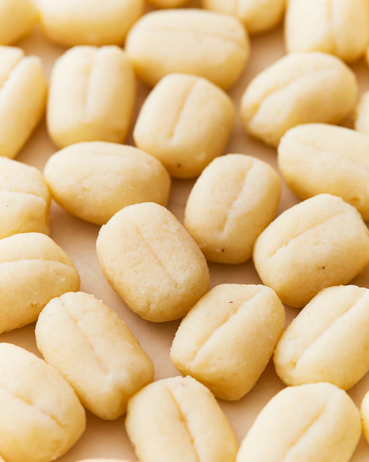 Group of gluten-free gnocchi  on parchment paper.