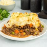gluten free shepherds pie serving on a white plate.