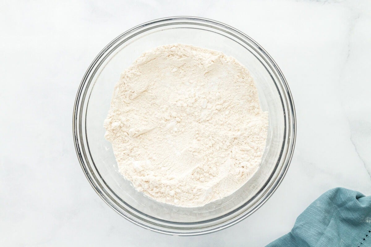 dry ingredients for gluten free sourdough bread in a glass bowl.