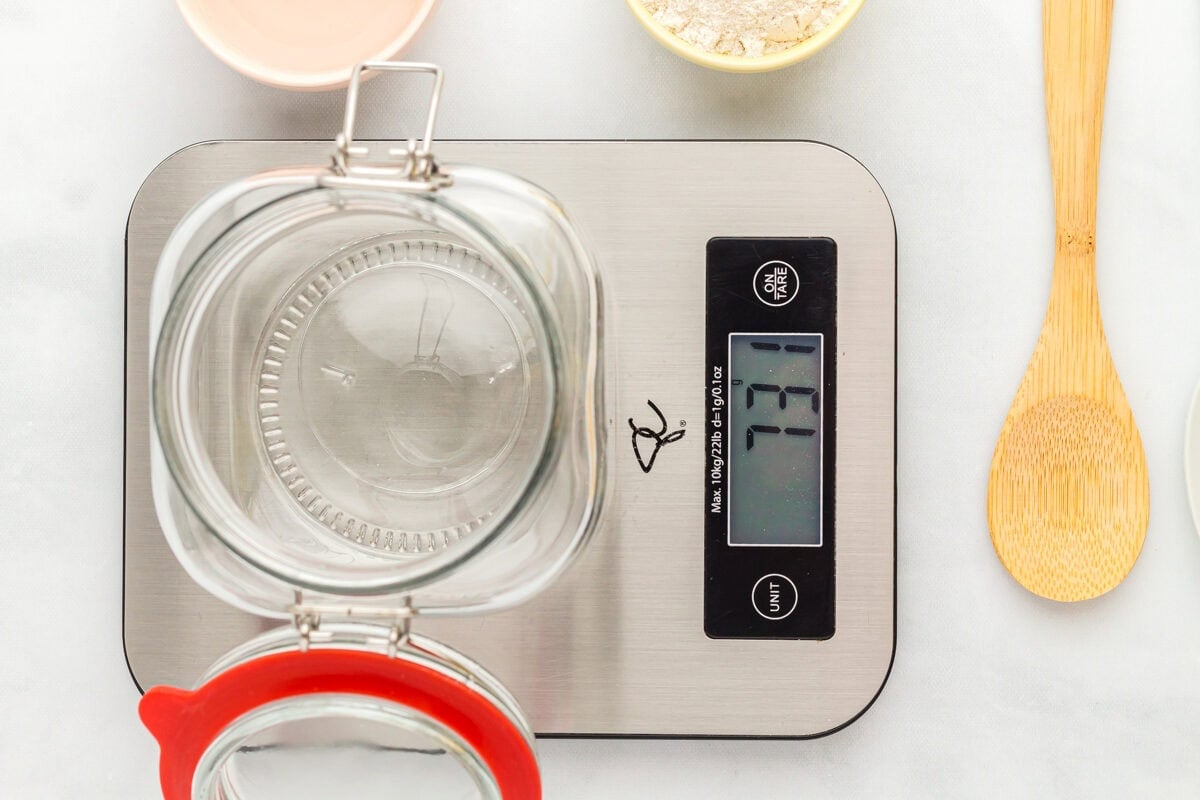 an empty jar on a scale that reads 731.