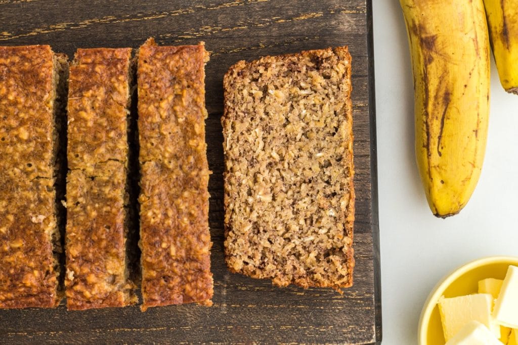 flourless banana bread sliced on wooden cutting board