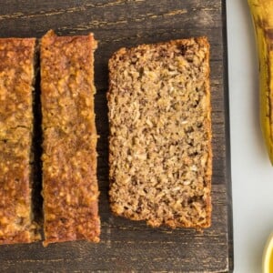 flourless banana bread sliced on wooden cutting board
