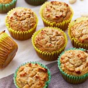almond flour banana muffins in colorful cupcake liners.