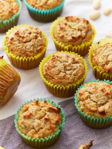 almond flour banana muffins in colorful cupcake liners.