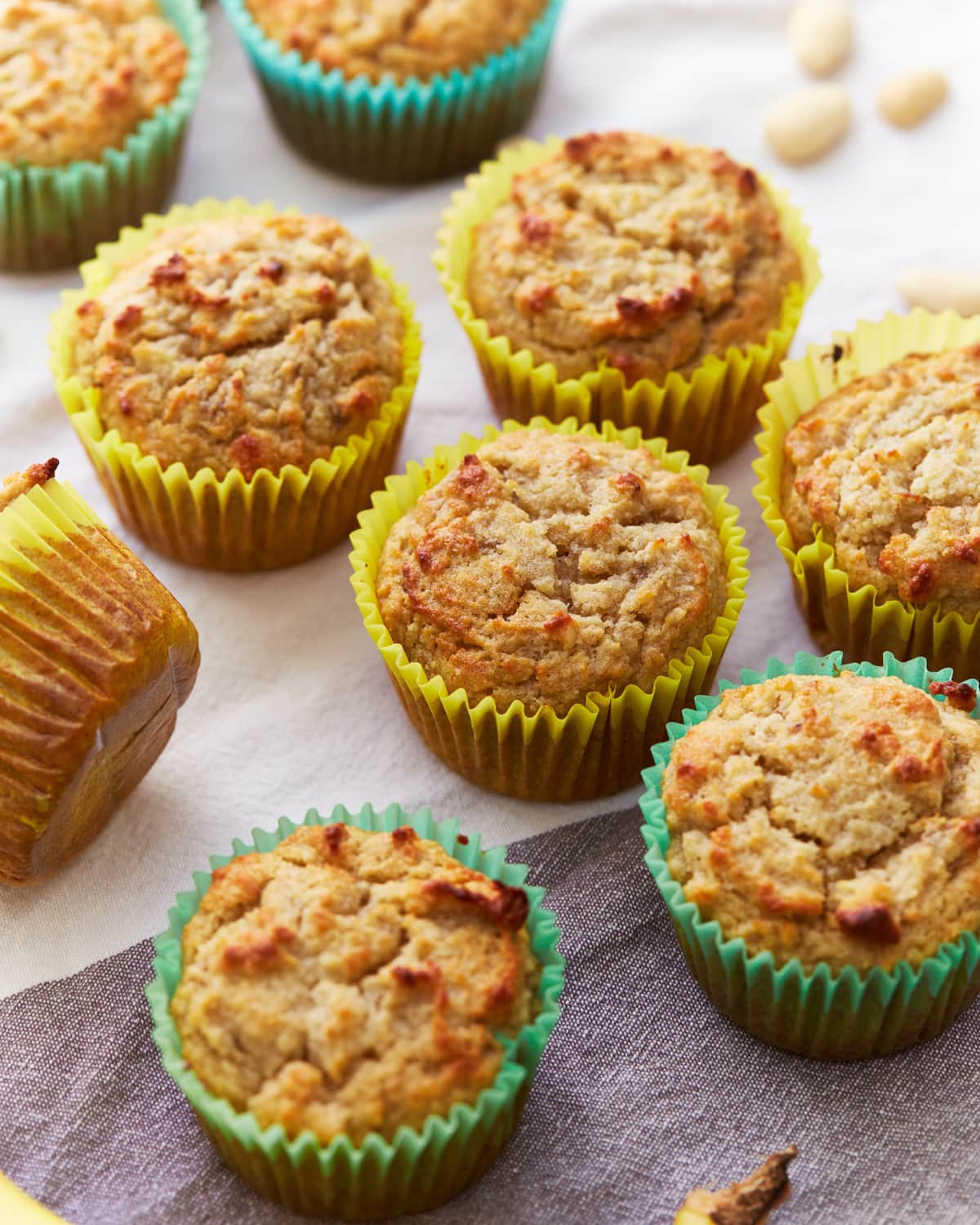 almond flour banana muffins in colorful cupcake liners.