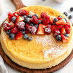 crustless cheesecake on cutting board with fruit