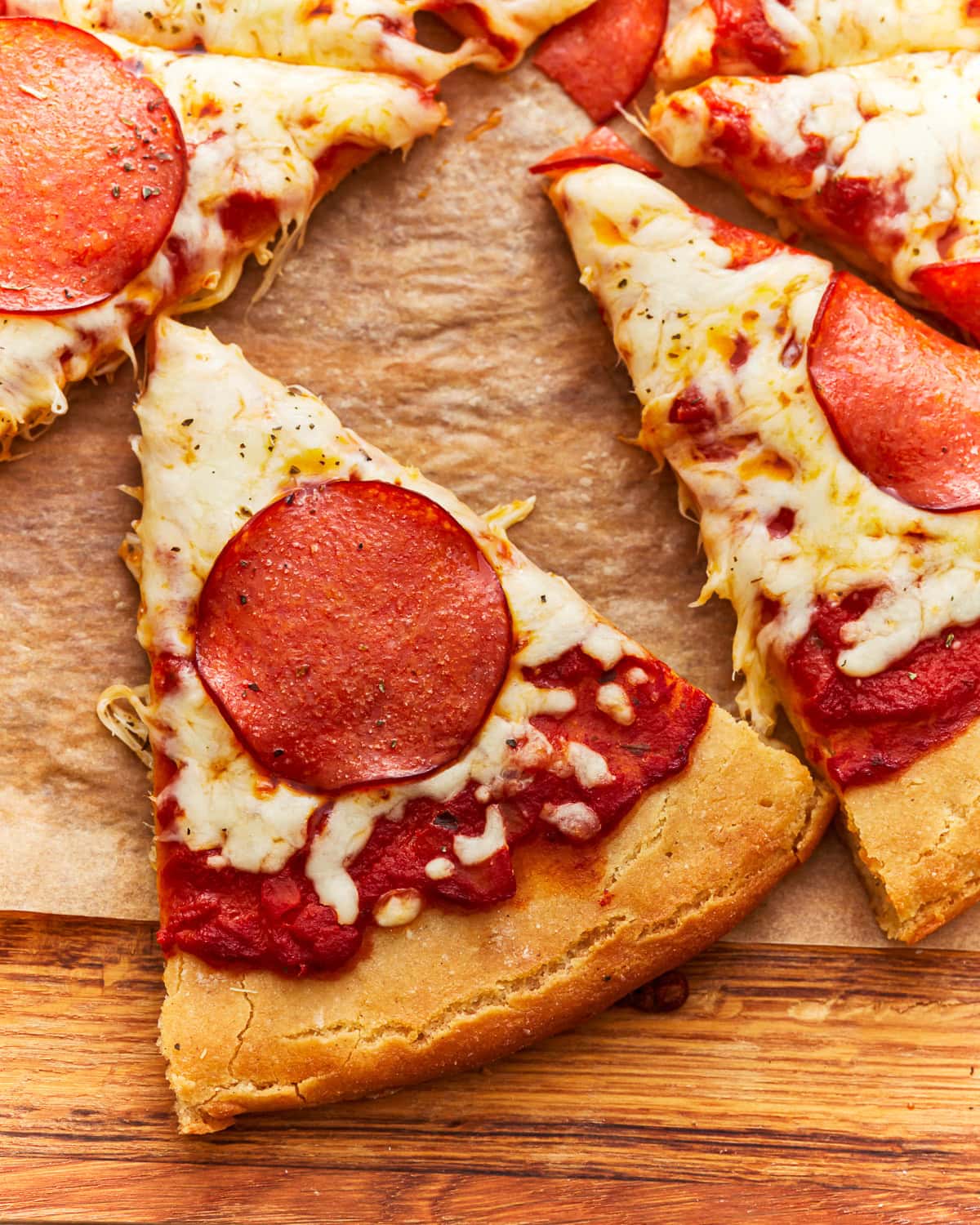 overhead view of a slice of gluten-free pepperoni pizza.