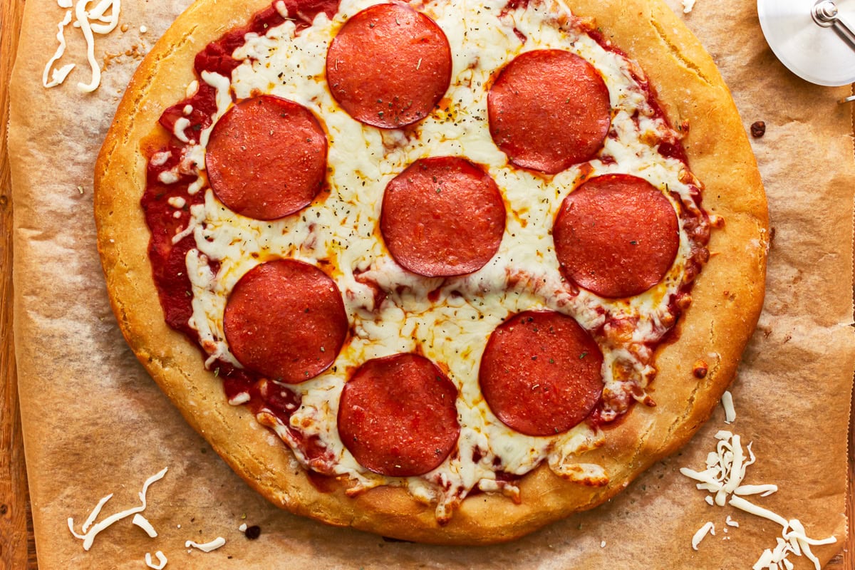 overhead view of a gluten-free pepperoni pizza.