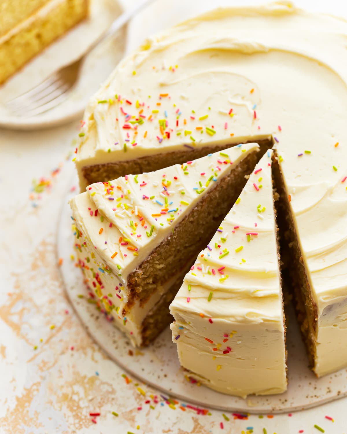 partially sliced gluten-free vanilla cake.