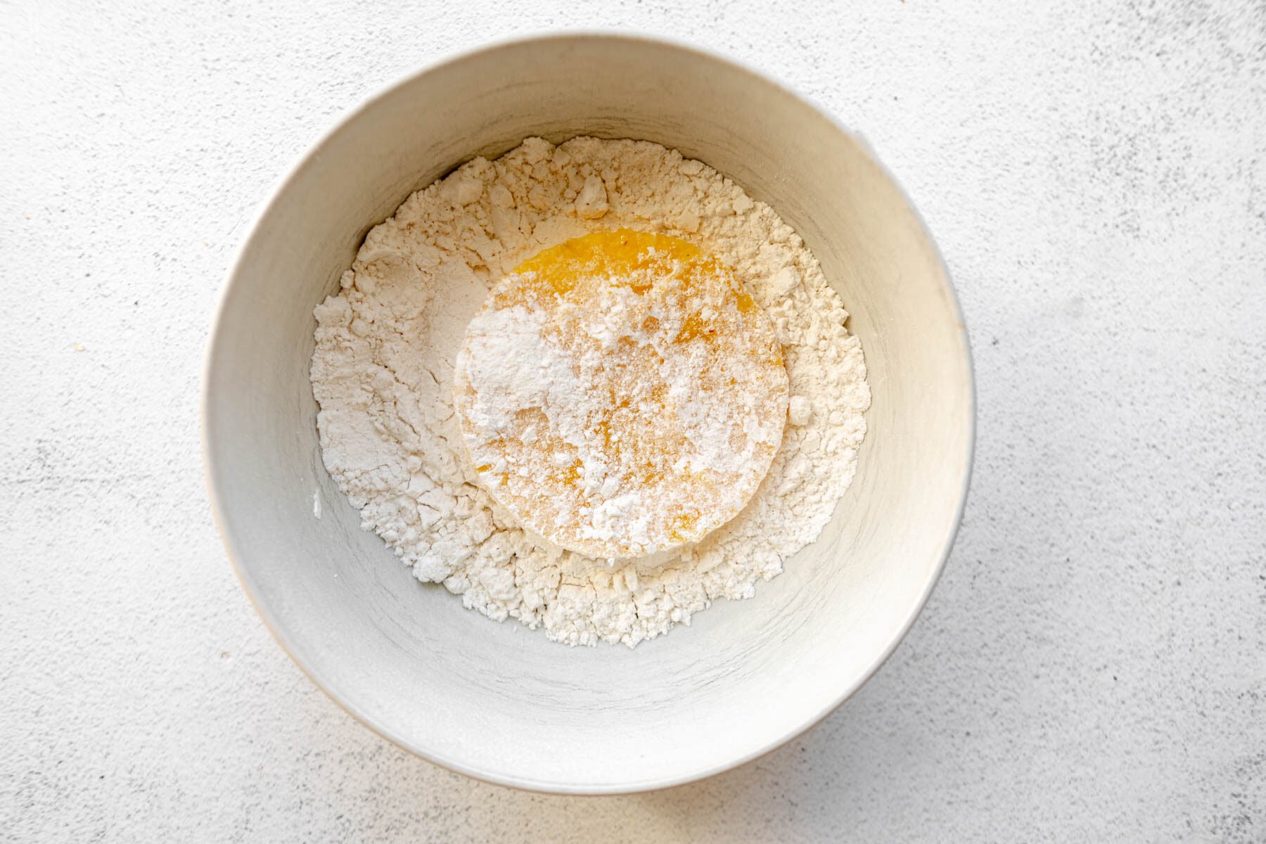 A grit cake dipped in flour.
