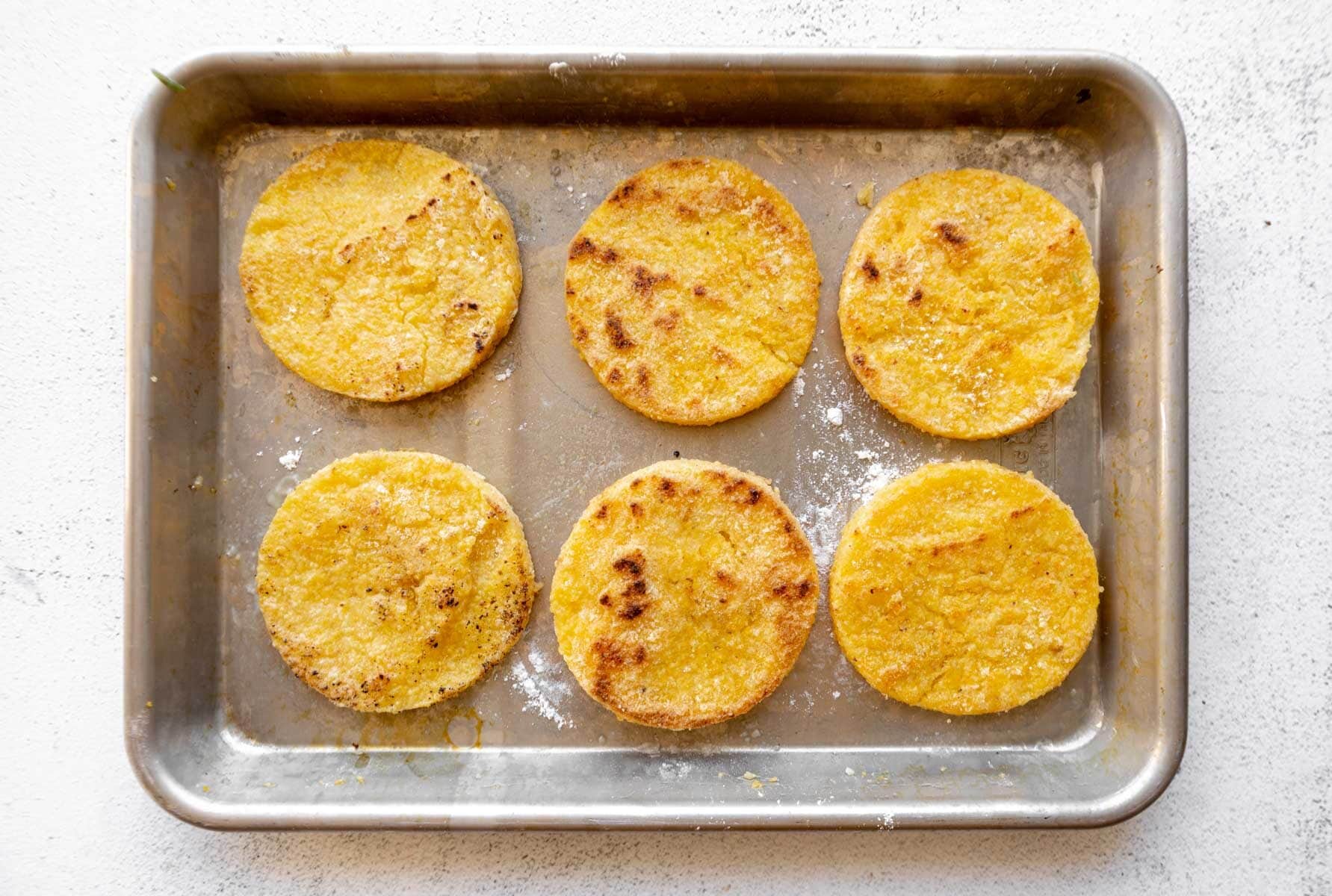 Grit cakes on a baking tray.