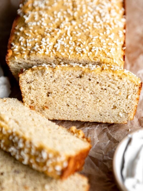 a partially sliced loaf of coconut flour bread.